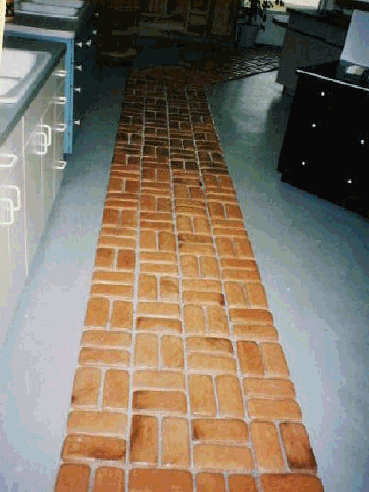 Brick veneer floor cast with concrete molds.