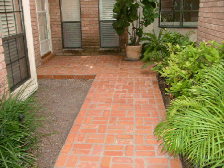 Concrete brick veneer entry path.