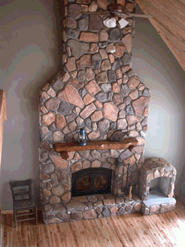 Fieldstone fireplace made with concrete stone from our molds by Tim McClelland.