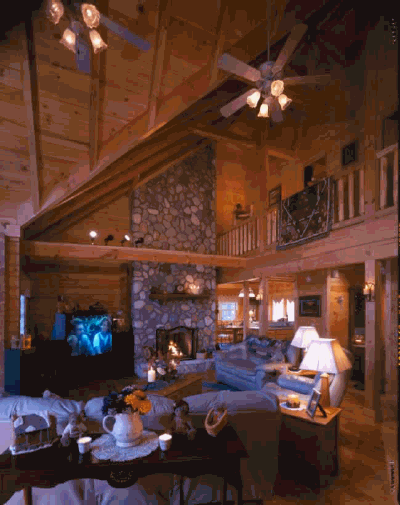 Floor to ceiling river rock stone fireplace.